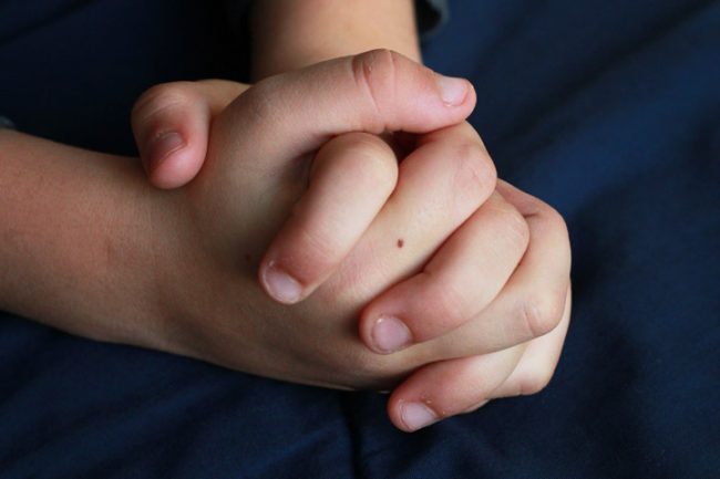 How to make prayer meaningful for young kids praying hands close up